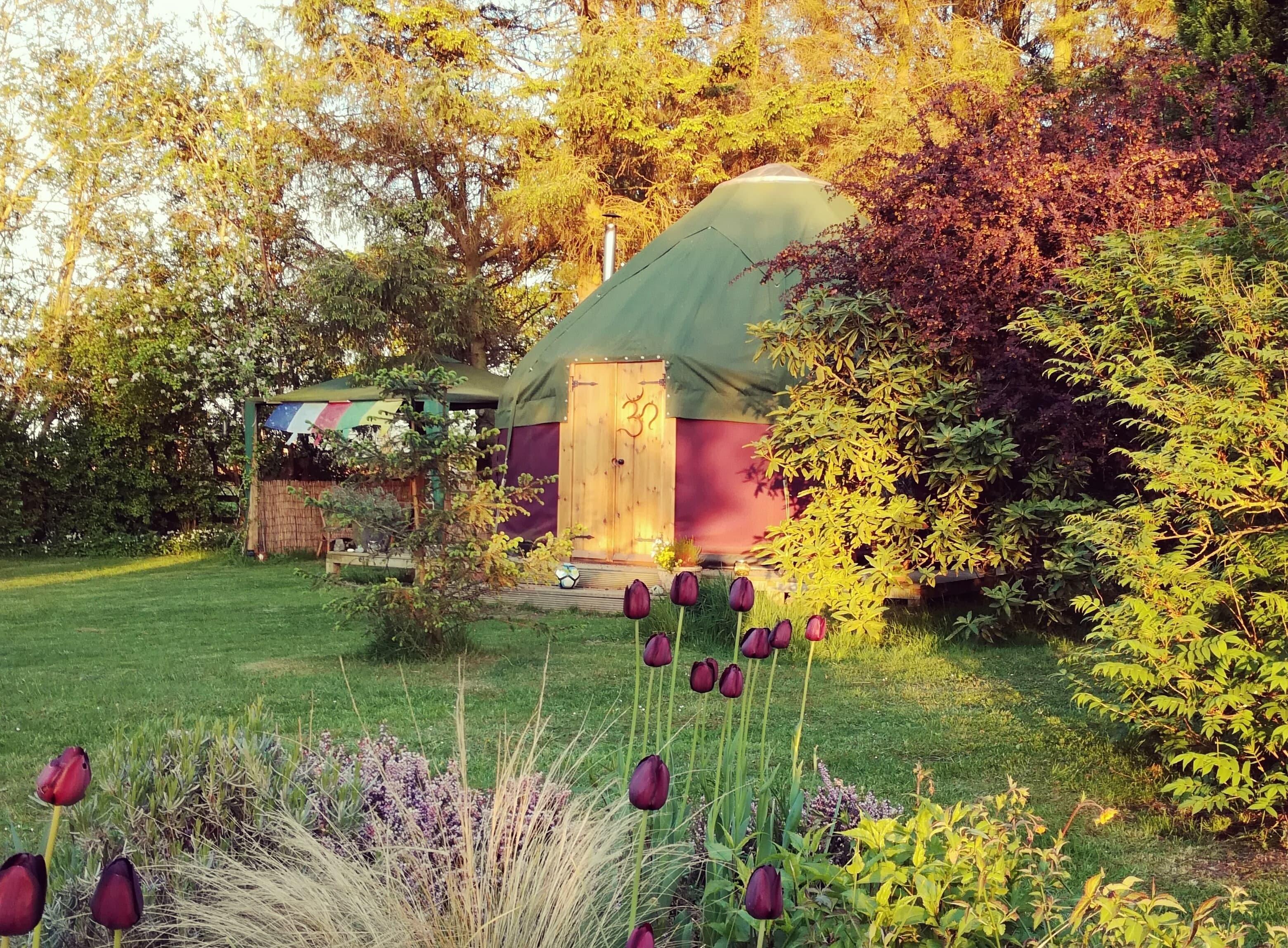 Side-facing picture of the Yurt during sunset.